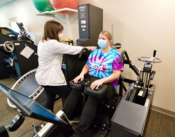 woman getting treatment on medx machine