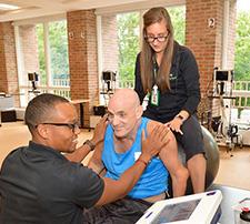 Rehabilitation experts with patient